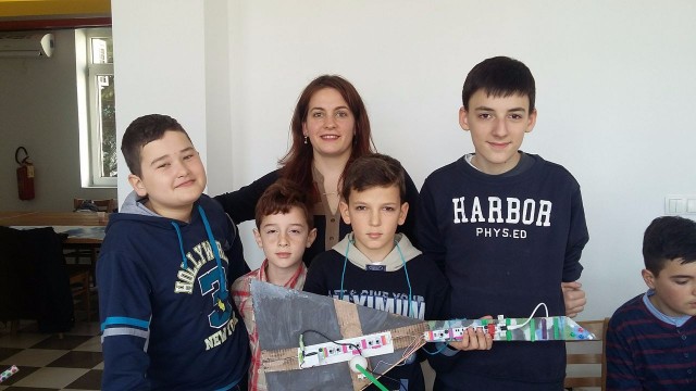 Young participants of Bonevet's LittleBits workshop and the electric guitar they built.